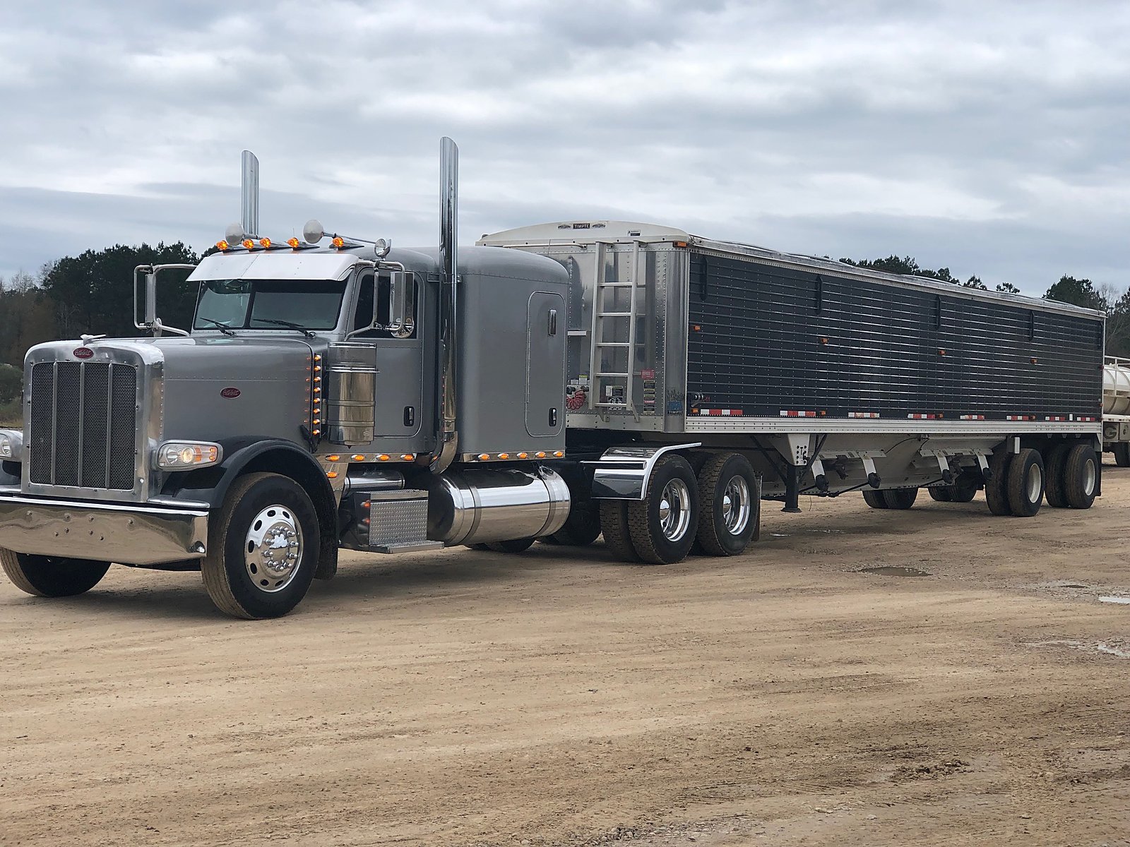 Silver Peterbilt with hopper trailer